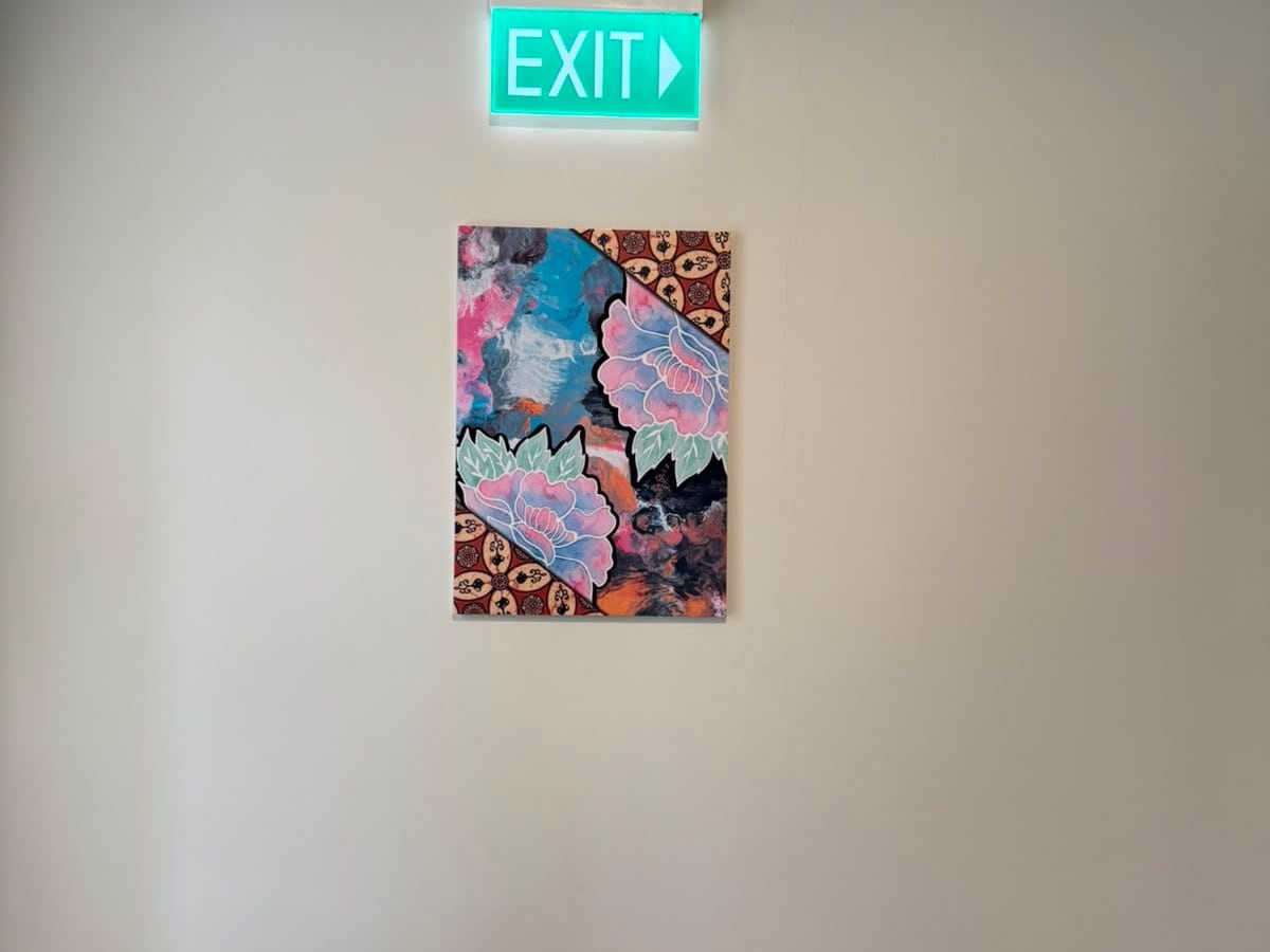 Colourful floral canvas print under an exit sign — Artist Canvas by Garrison Productions, Singapore