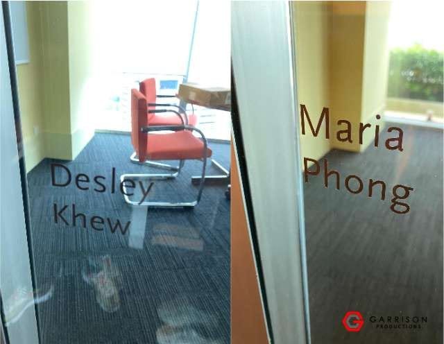 Die-cut name stickers on office glass — Die Cut Stickers by Garrison Productions, Singapore