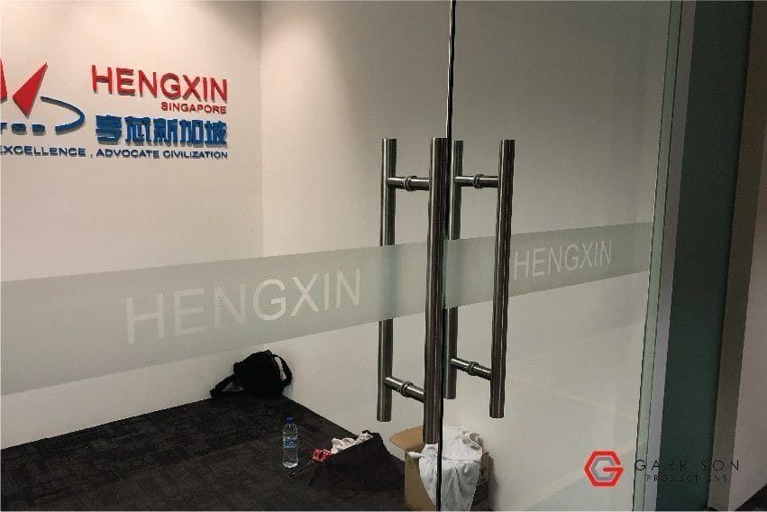 Hengxin logo frosted film on glass doors — Frosted Film by Garrison Productions, Singapore