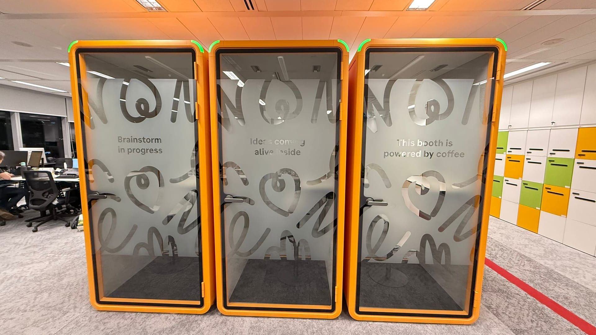 Frosted film on orange office pods — Frosted Film by Garrison Productions, Singapore