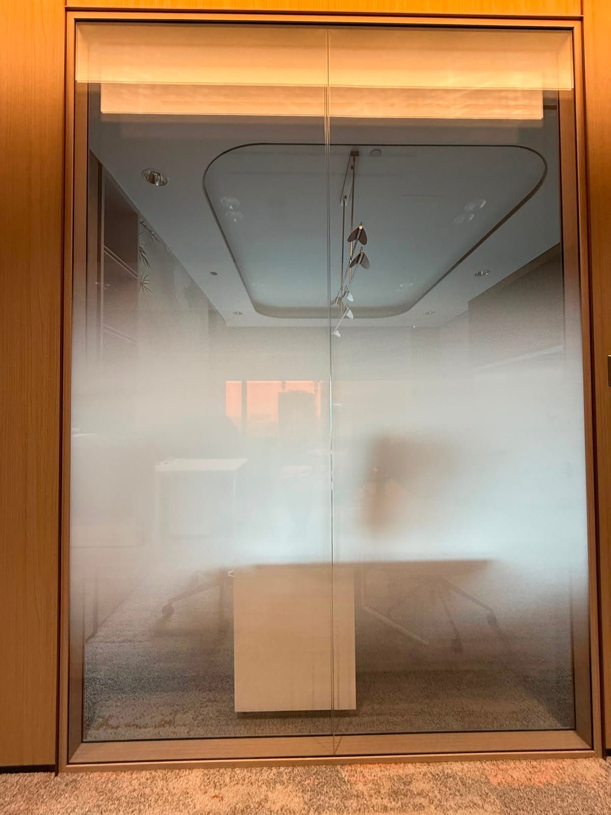 Gradient frosted film on a lit glass room — Frosted Film by Garrison Productions, Singapore