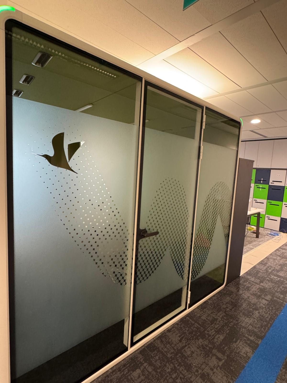 Frosted glass sticker with bird logo on meeting room doors — Glass Stickers by Garrison Productions, Singapore