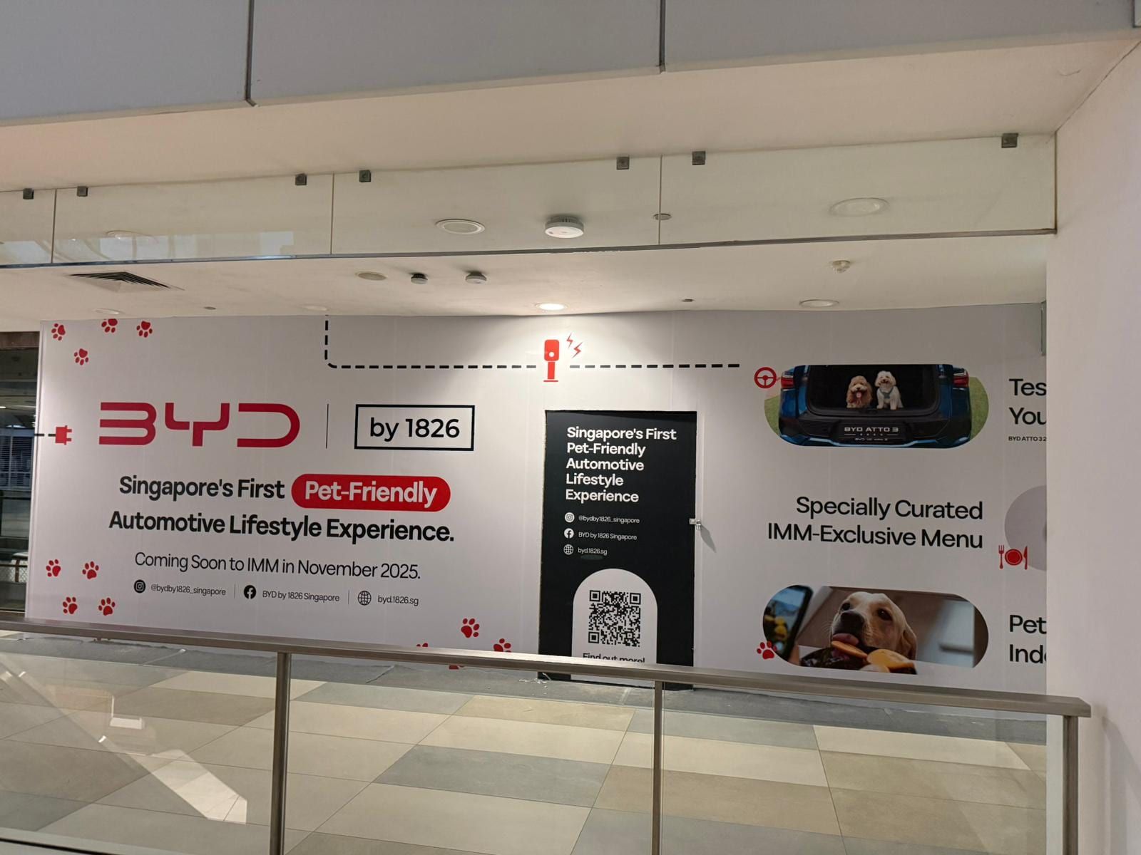 BYD showroom hoarding with QR code panels — Hoarding Sticker Printing by Garrison Productions, Singapore