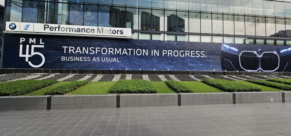 BMW Performance Motors PML 45 hoarding across the showroom frontage — Hoarding Sticker Printing by Garrison Productions, Singapore
