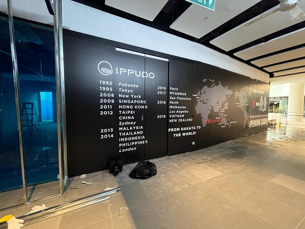 Ippudo world map hoarding inside a mall — Hoarding Sticker Printing by Garrison Productions, Singapore