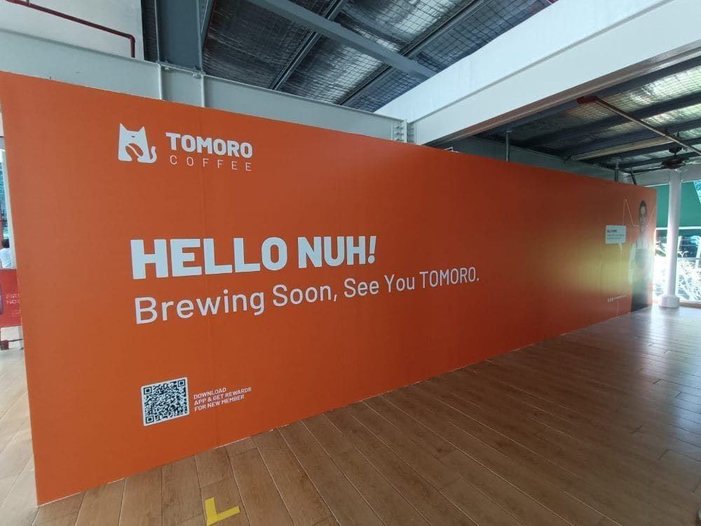 Tomoro Coffee "Hello nuh! Brewing soon" orange hoarding — Hoarding Sticker Printing by Garrison Productions, Singapore