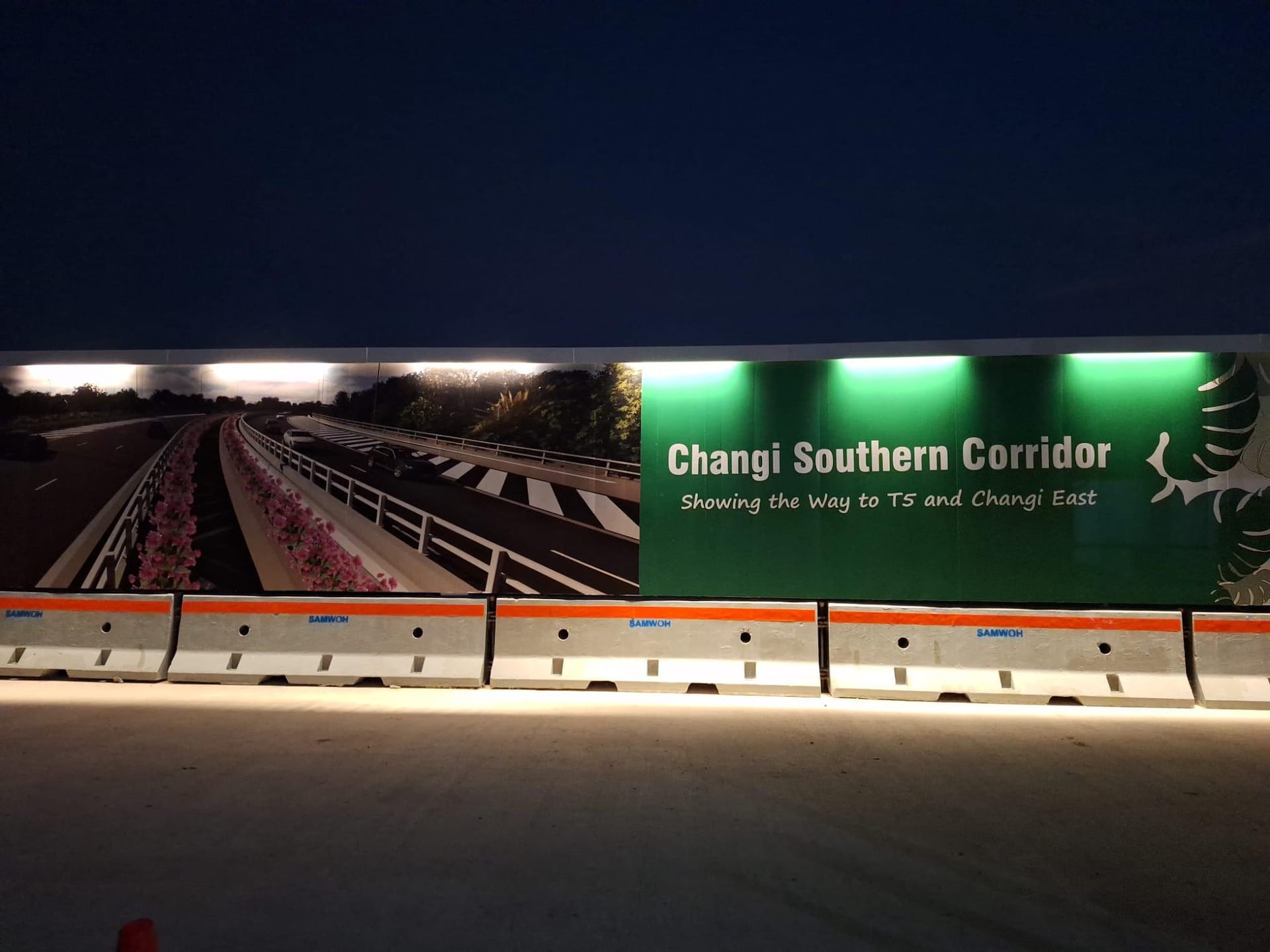 LTA Changi Southern Corridor hoarding lit up at night — Hoarding Sticker Printing by Garrison Productions, Singapore