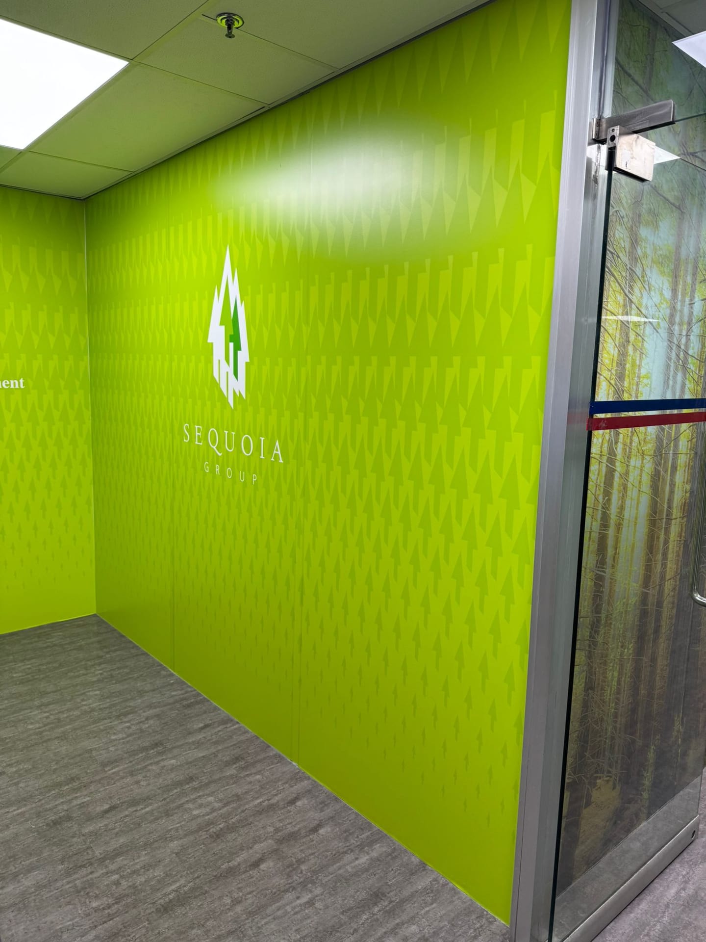 Lime green branded wall graphic in an office — Wall Mural by Garrison Productions, Singapore
